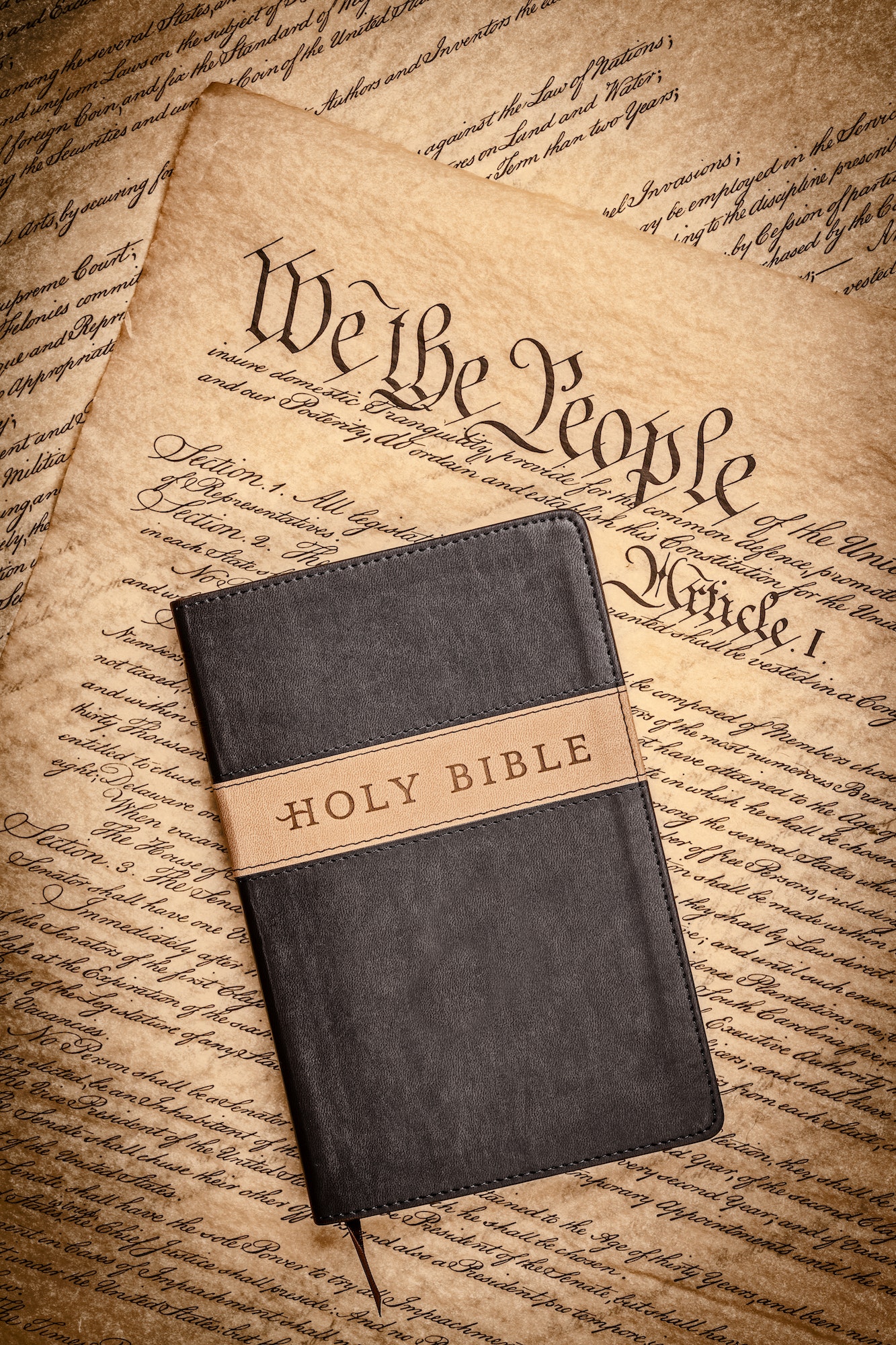 Holy bible and small cross on the constitution
